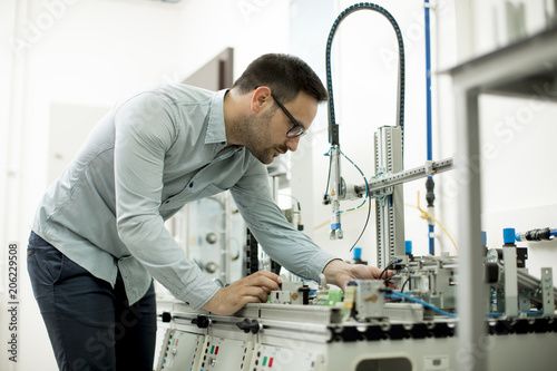 Young man in the electronic workshop