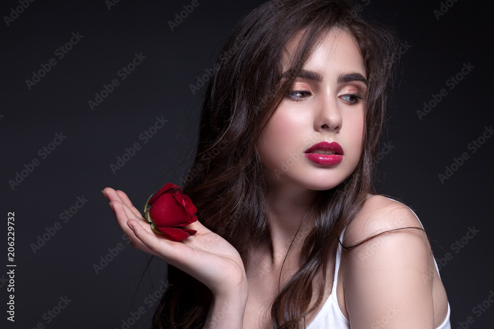 Classic portrait of a teenage girl in a white shirt. Classic portrait of a teenage girl in a white shirt.