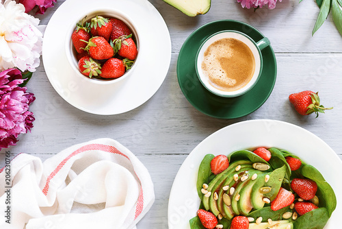 breakfast vegan salad with avocado  strawberries  pine nuts