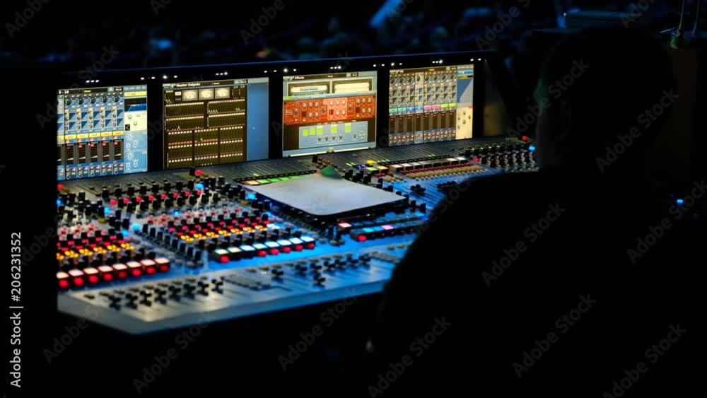 Technical staff is working at the conference, audio and video equipment in progress