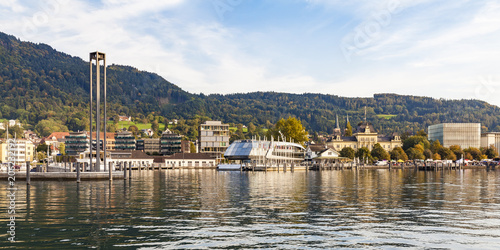 Austria, Vorarlberg, Bregenz, Lake Constance, Harbor with tour boat, Kunsthaus Bregenz in the background photo