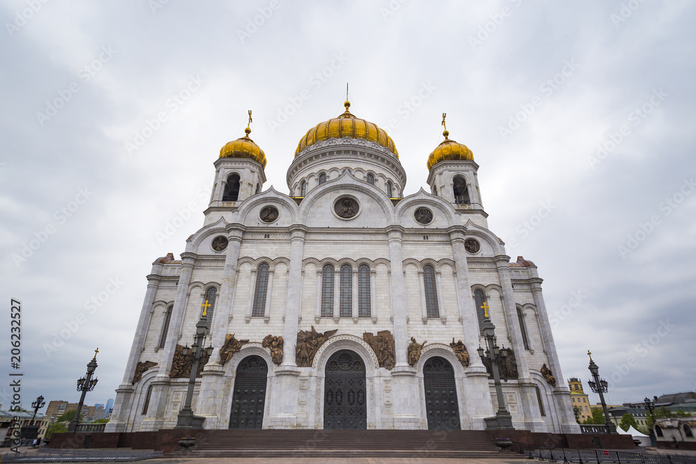 Perspective view at Cathedral of Christ the Saviour in Moscow, Russia with gloomy sky background.