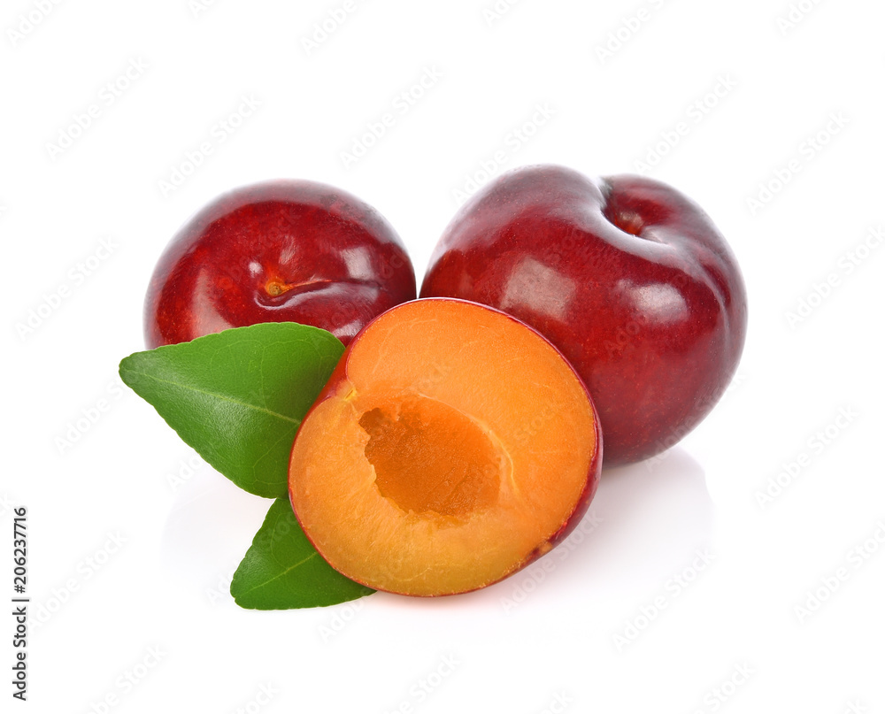 red cherry plum with green leaves isolated on white background red cherry plum with green leaves isolated on white background