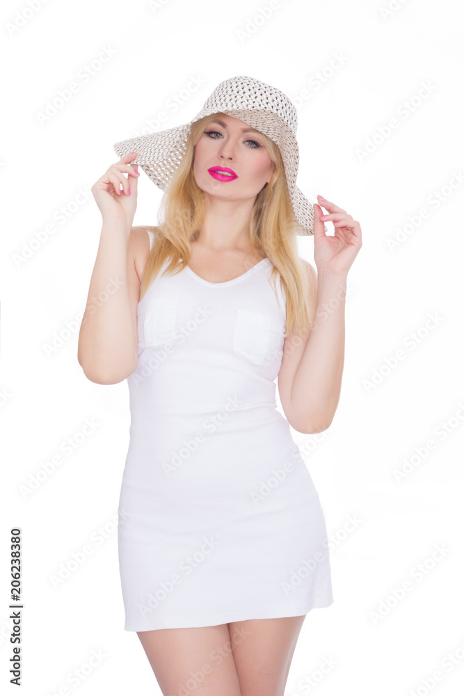 Beautiful young blond woman in a hat. Studio. Isolate. Concept - summer mood Beautiful young blond woman in a hat. Studio. Isolate. Concept - summer mood
