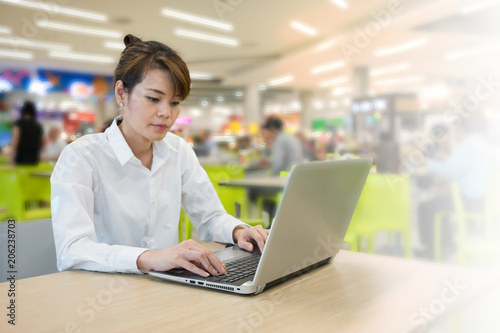 Happy Business woman using laptop at office work space.selective focus image.