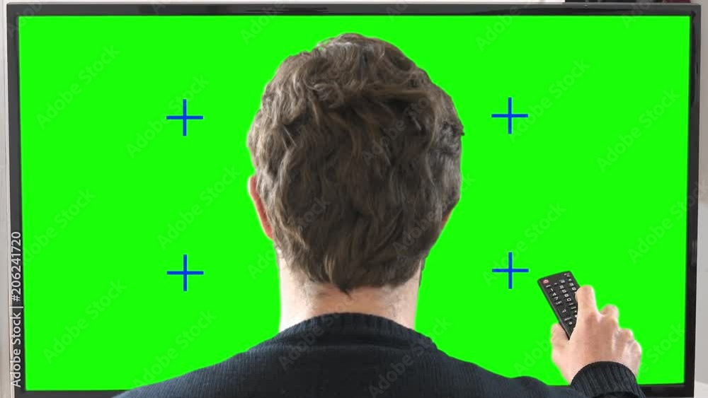 Channel Surfing Green Screen Zoom In. Man changing channels on a big