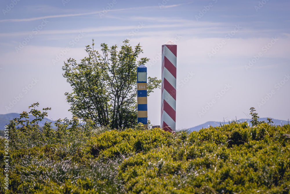 Fototapeta premium Border markes on a Polish-Ukraine boundary, seen from a trail in Bieszczady Mountains National Park, Poland
