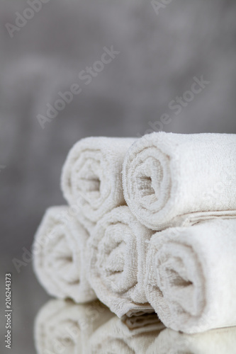 Pile of white towels © George Dolgikh