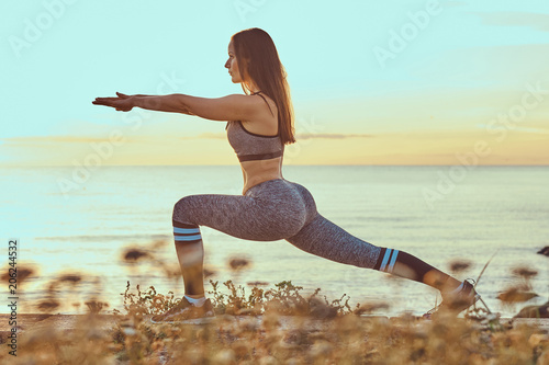 Fitness woman practicing st...