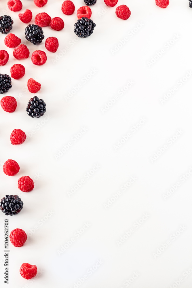 Frame isolated of Composition of fresh summer fruit, raspberries and blackberries on white background. Mediterranean diet with varied summer fruits. Stock photo. Top View Frame isolated of Composition of fresh summer fruit, raspberries and blackberries on white background. Mediterranean diet with varied summer fruits. Stock photo. Top View