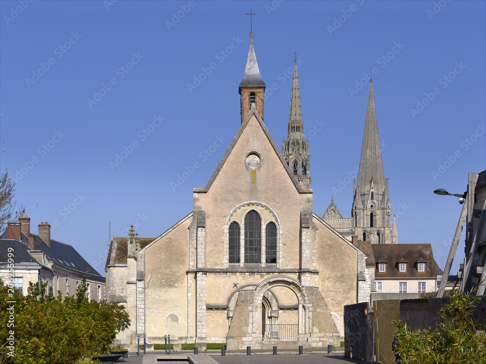 Facade of church of Saint-Pierre with the cadral Notre-Dame in the background of Chartres, a commune and capital of the Eure-et-Loir department in region Centre-Val de Loire in France.