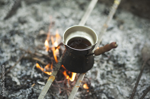 coffee by the fire in nature