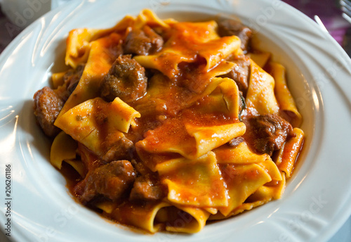 Pappardelle with boar ragu. Tuscan typical recipe. photo