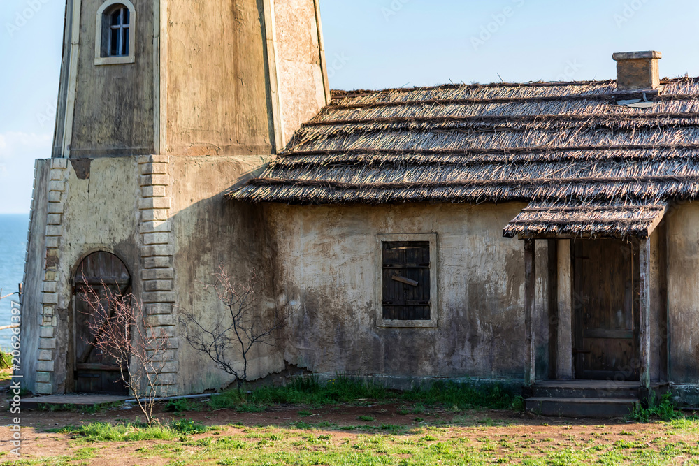 Obraz premium Close up lighthouse building near sea