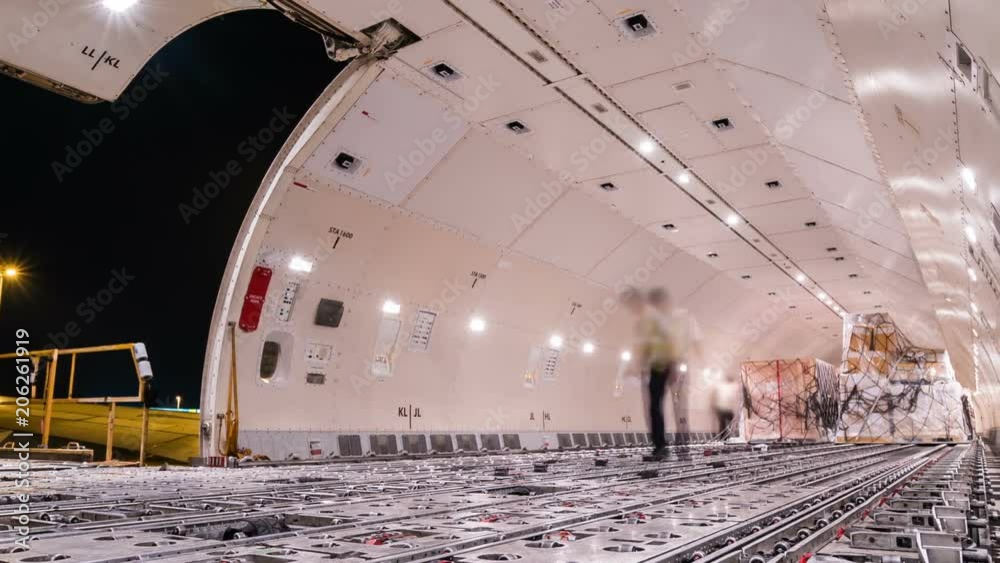 Panning time lapse unloading cargo inside cargo plane