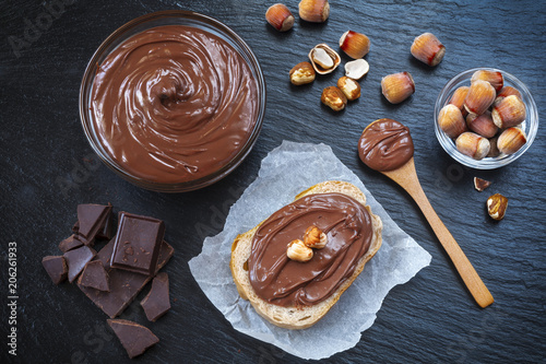 Obraz na plátně Breakfast with chocolate spread in glass bowl