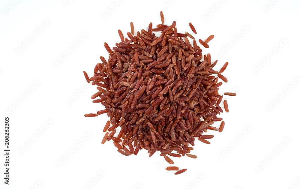 Pile of brown unpeeled rice isolated on white background. One of the varieties of rice. Pile of brown unpeeled rice isolated on white background. One of the varieties of rice.