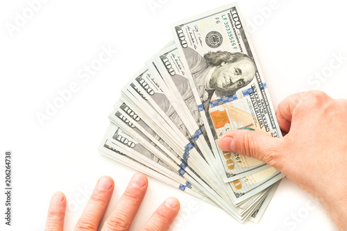 American currency, hundred dollar banknotes on a white background.