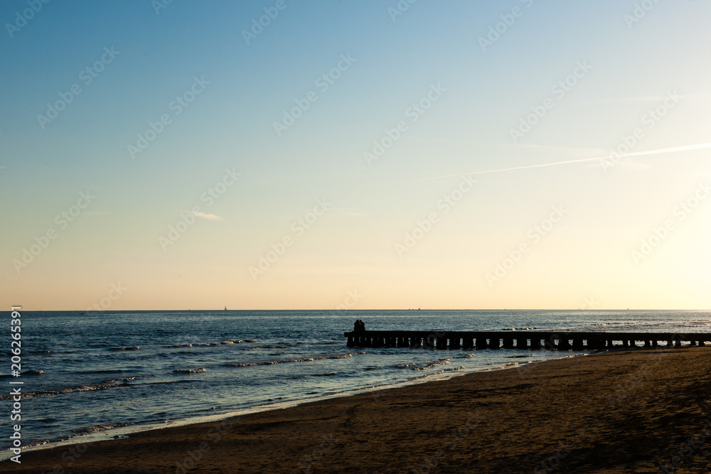 Beach at dawn, piers perspective view