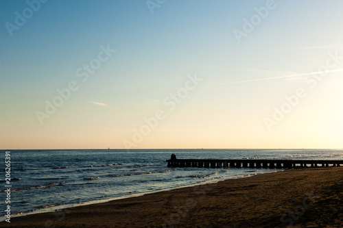 Beach at dawn  piers perspective view