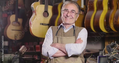 In his laboratory, a liutist builds high quality guitars for musicians, working fine wood. Concept of: music, tradition, ancient crafts.