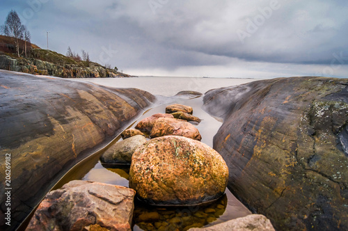 Rocks and sea on a cloudy day in Helsinki in Finland