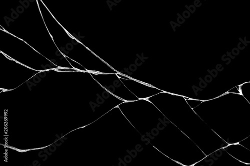 wrinkles and cracks of glass caused by smashing and falling bumps. isolated on black background photo