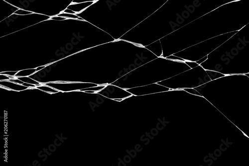 wrinkles and cracks of glass caused by smashing and falling bumps. isolated on black background