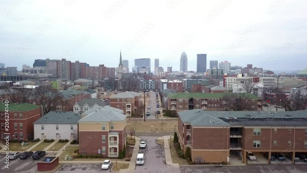 Aerial view of Louisville Kentucky ( panning shot) with buildings and warehouses seen Aerial view of Louisville Kentucky ( panning shot) with buildings and warehouses seen