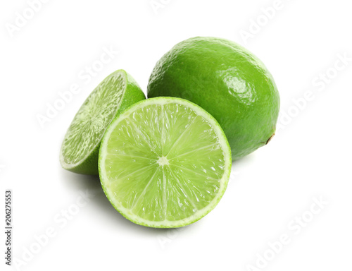 Fresh ripe green limes on white background