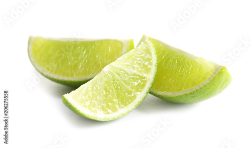 Slices of fresh ripe lime on white background