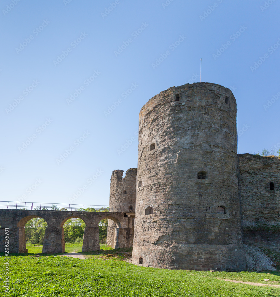 The bridge, wall and towers of the fortress Koporye in the Leningrad region, Russia. Stone fort built by 1297