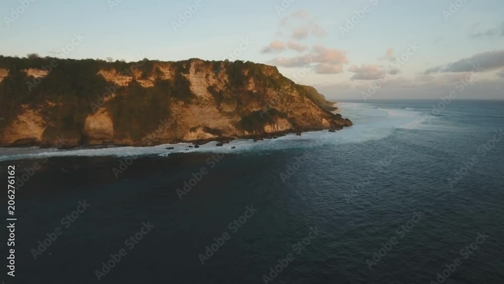 Aerial view of Sunset over the sea, coast, sea, beach, sky, clouds. Bali, Indonesia. Sunset on the island of Bali. 4K, Aerial footage Aerial view of Sunset over the sea, coast, sea, beach, sky, clouds. Bali, Indonesia. Sunset on the island of Bali. 4K, Aerial footage
