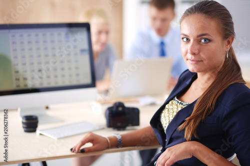 Portrait of an attractive young businesswoman sitting in front of a computer.businesswoman .