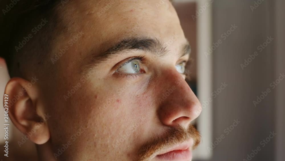 closeup inside portrait of young handsome bearded caucasian man thinking and looking away calm peaceful male face beautiful eyes brown mustache natural human beauty cool hipster urban lifestyle closeup inside portrait of young handsome bearded caucasian man thinking and looking away calm peaceful male face beautiful eyes brown mustache natural human beauty cool hipster urban lifestyle