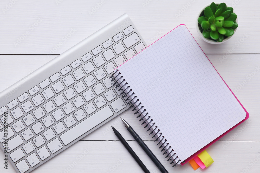 top view image of open notebook with blank pages on wooden table. ready for adding text or mockup. top view image of open notebook with blank pages on wooden table. ready for adding text or mockup.