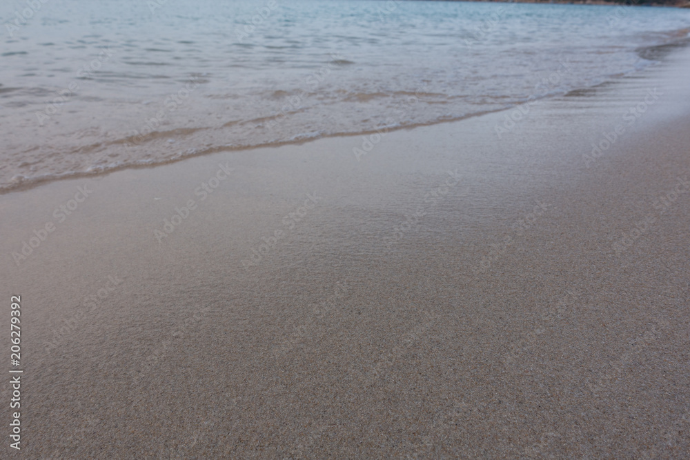 Beautiful background transparent surface wave, sand on clean seaside beach. Royalty high-quality free stock video footage of clean surface seawater, waves on the beach with sand and sunshine in summer Beautiful background transparent surface wave, sand on clean seaside beach. Royalty high-quality free stock video footage of clean surface seawater, waves on the beach with sand and sunshine in summer