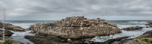 Quartz veins in giant granite rock at sea