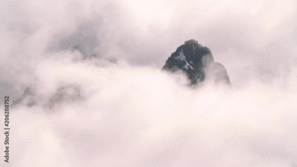 Breathtaking Rolling Clouds Timelapse of Majestic Peak