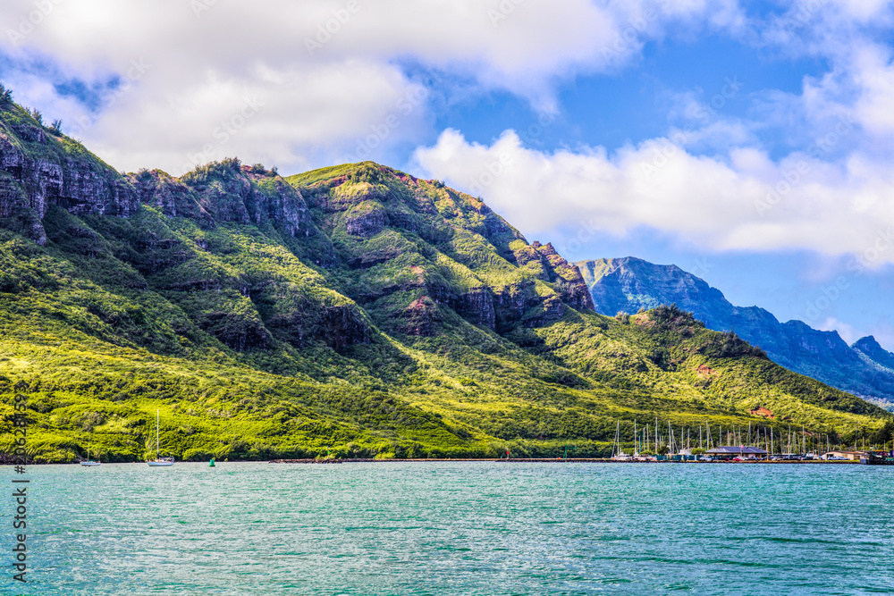 Sailboats in a Tropical Harbor Surrounded by Mountains