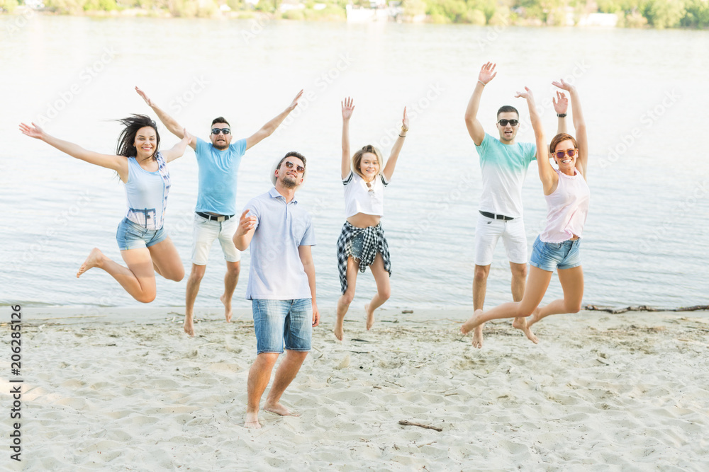Group of people jumping on the beach Group of people jumping on the beach
