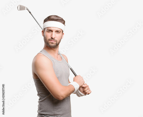 young handsome sportsman with golf brat wearing gray tank top . person isolated against monochrome background