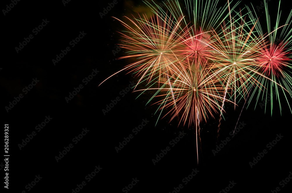 Fototapeta premium Fireworks celebration and the night sky background.