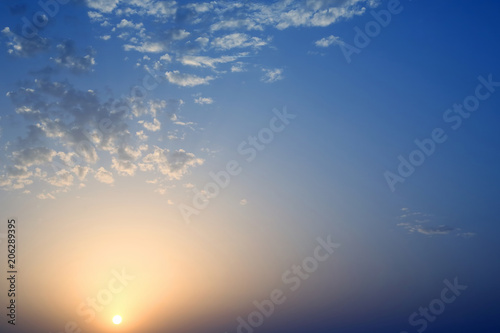 Dawn of the sun in juicy clouds