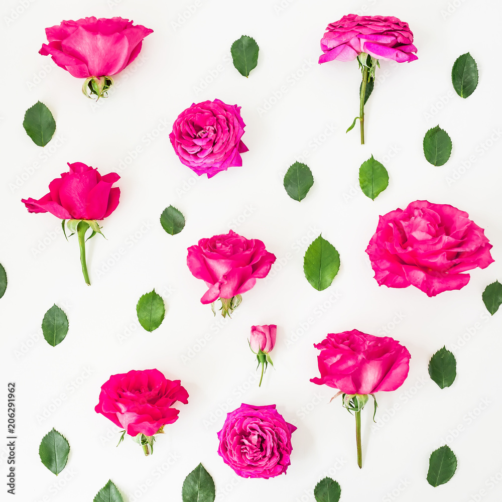 Floral pattern made of pink roses and leaves on white background. Flat lay, Top view. Summer composition