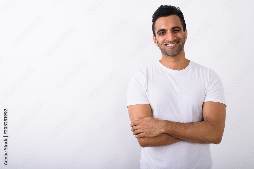 Young handsome Indian man against white background Young handsome Indian man against white background