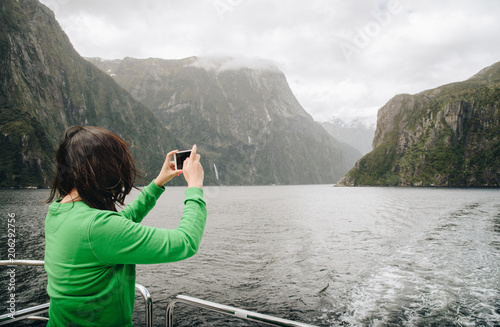 Tourist travel in Milford Sound, New Zealand's most spectacular natural attraction in south island of New Zealand.