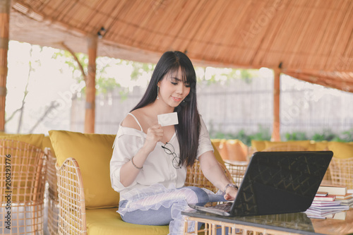 Free Download Business Concept. Young Asian Beautiful young business people are happy to shop online. Young businesswoman working in a cafe. Beautiful young business woman is shopping online. - GFXLoad