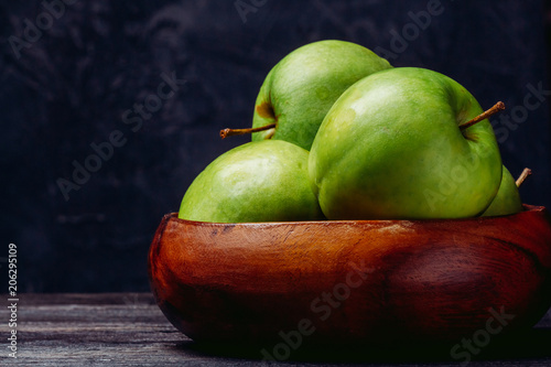 Beautiful apples in a wooden bowl
