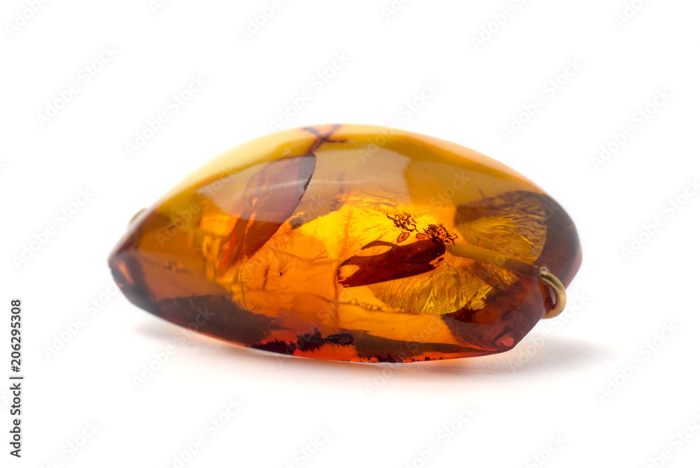 Amber brooch isolated on white background. Amber brooch isolated on white background.